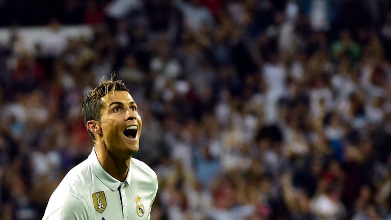 Real Madrid's Portuguese forward Cristiano Ronaldo celebrates after scoring during the Spanish league football match Real Madrid CF vs Sevilla FC at the Sa