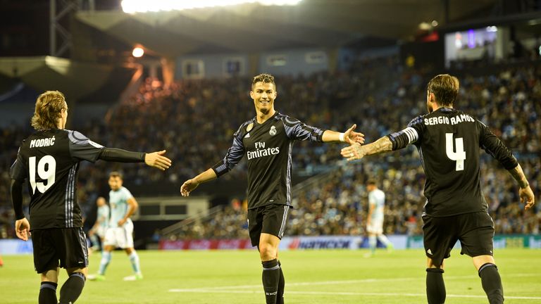 VIGO, SPAIN - MAY 17: Luka Modric, Cristiano Ronaldo and Sergio Ramos of Real Madrid celebrates the third goal against RC Celta during the La Liga match, b