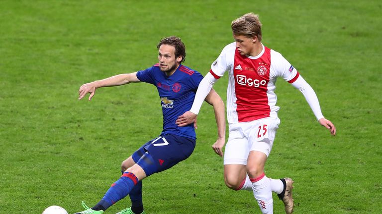 STOCKHOLM, SWEDEN - MAY 24: Daley Blind of Manchester United and Kasper Dolberg of Ajax battle for possession during the UEFA Europa League Final between A