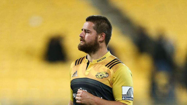 Dane Coles of the Hurricanes hobbles on an injured knee