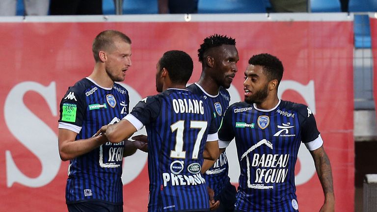 Troyes' midfielder Stephane Darbion (L) celebrates with teammates after scoring a goal during the Ligue 2 football match Troyes versus Lorient on May 25, 2