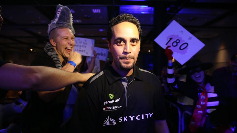 Cody Harris of Auckland makes his wy to the stage in the New Zealand Super League Darts Competition