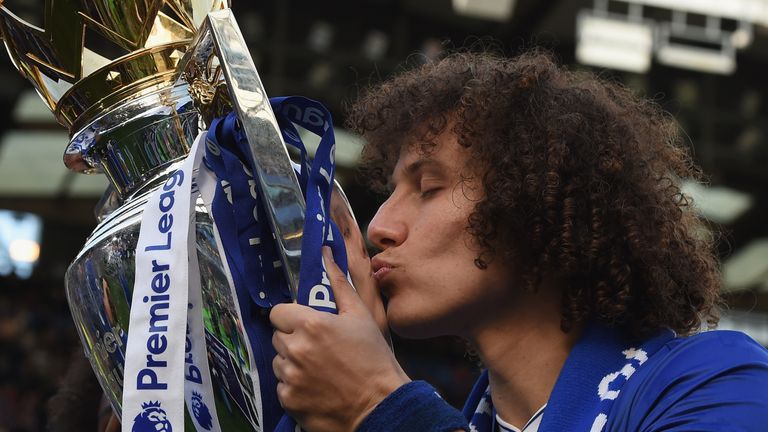 LONDON, ENGLAND - MAY 21:  David Luiz of Chelsea poses with the Premier League trophy after the Premier League match between Chelsea and Sunderland at Stam