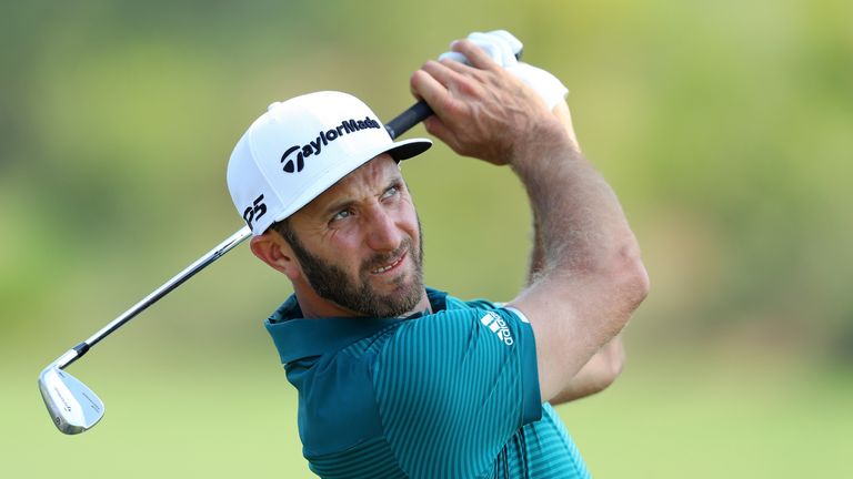 PONTE VEDRA BEACH, FL - MAY 10:  Dustin Johnson of the United States plays a shot during a practice round prior to the THE PLAYERS Championship at the Stad