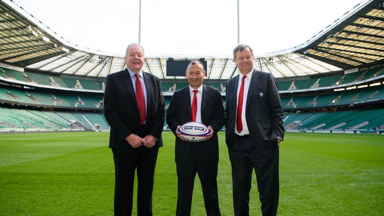 The new England rugby union head coach Eddie Jones poses for photographers with a ball on the pitch with Chairman of the Rugby Football Union Bill Beaumont