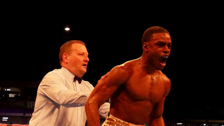Errol Spence JR (R) reacts after knocking down Kell Brook in their IBF Welterweight World Championship contest at Bramall Lane