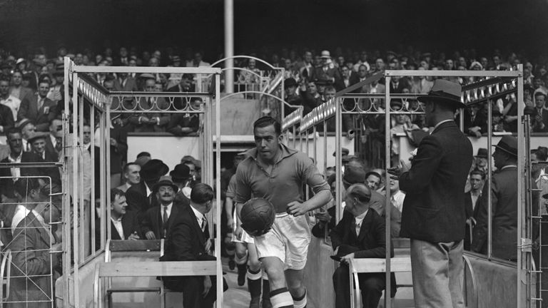 Everton Football Club captain Dixie Dean (1907 - 1980) leads his team out for a match against Arsenal FC at Highbury in London.   (Photo by Barker/Getty Im