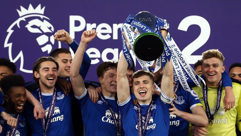 LIVERPOOL, ENGLAND - MAY 08:  Jonjoe Kenny of Everton lifts the trophy and celebrates winning the league with team mates during the Premier League 2 match 
