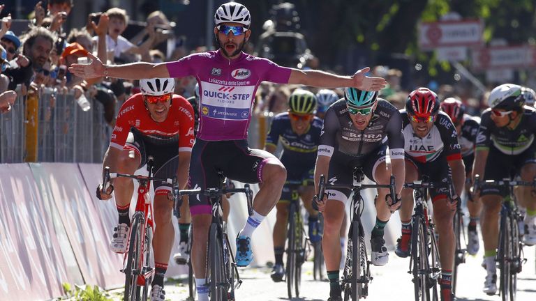 Fernando Gaviria of Quick Step team, celebrates as he crosses the finish line to win ahead of Sam Bennett (Bora) (R) on Giro d'Italia Stage 13