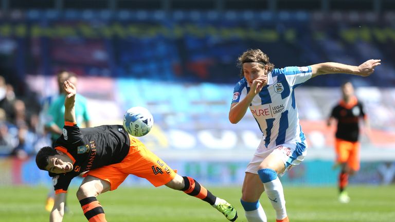 Fernando Forestieri of Sheffield Wednesday and Michael Hefele of Huddersfield Town battle for possession during the Sky Bet Championship playoff semi-final