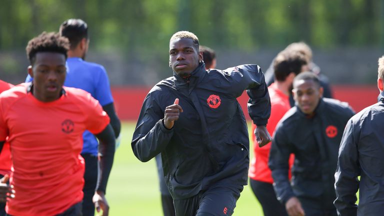 Paul Pogba takes part in training at Manchester United's Aon Training Complex