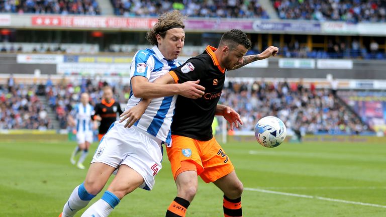Michael Hefele of Huddersfield Town and Daniel Pudil of Sheffield Wednesday battle for possession during the Sky Bet Championship