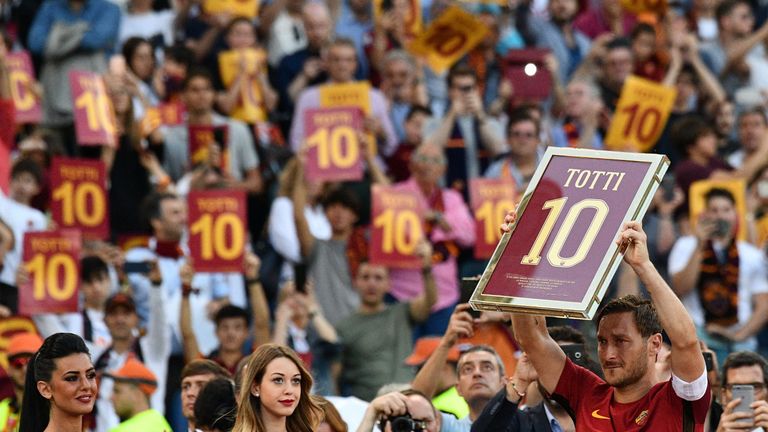 Roma's forward from Italy Francesco Totti holds a framed Number 10 during a ceremony to celebrate his last match with AS Roma after the Italian Serie A foo
