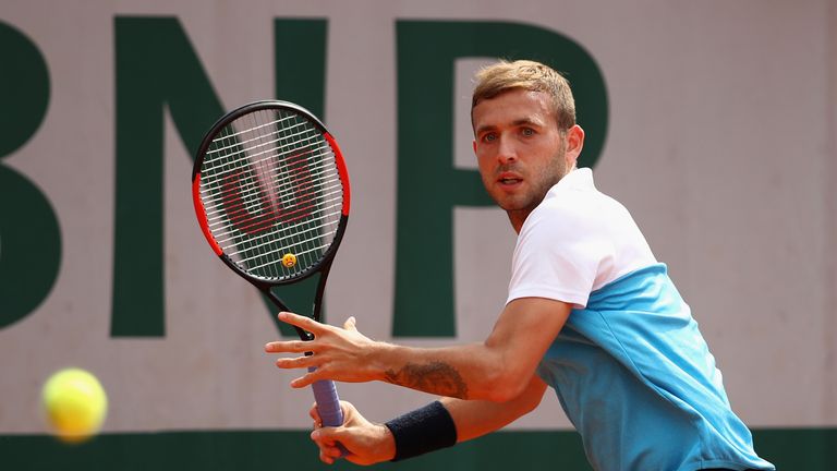 Dan Evans of Great Britain plays a forehand during the mens singles first round match against Tommy Robredo