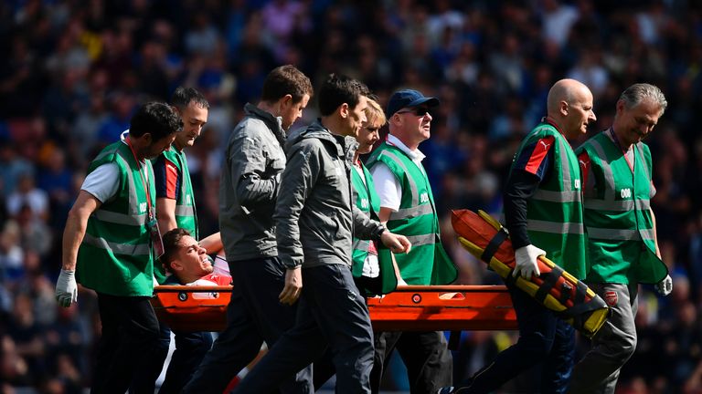 Gabriel is stretchered off injured during the English Premier League football match between Arsenal and Everton at the Emirates Stadium