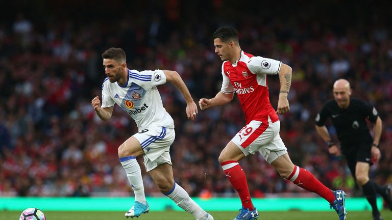 Granit Xhaka puts Fabio Borini under pressure in the early stages at the Emirates