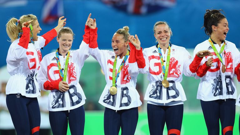 Great Britain players (L-R) Georgie Twigg, Helen Richardson-Walsh, Susannah Townsend, Kate Richardson-Walsh and Sam Quek react with their gold medals