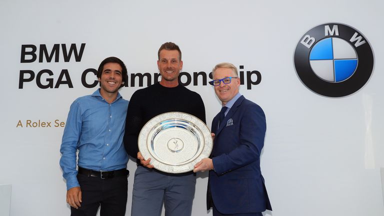 VIRGINIA WATER, ENGLAND - MAY 23:  Henrik Stenson of Sweden (centre) receives his Seve Ballesteros award from Javier Ballesteros, the son of Seve Ballester