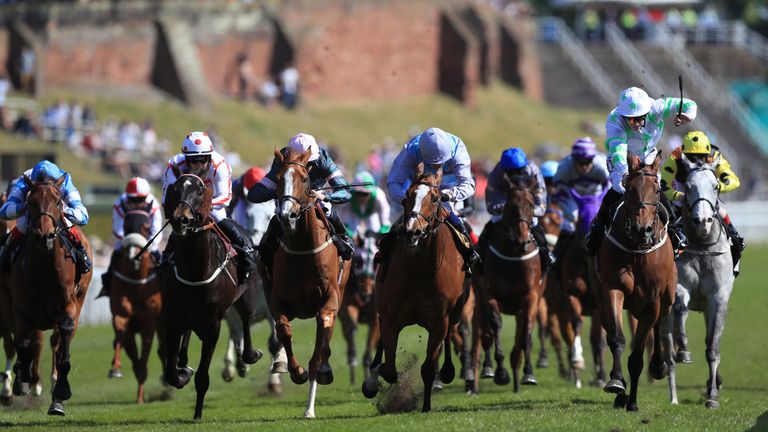 Montaly ridden by jockey Oisin Murphy (centre right) on the way to winning the 188Bet Chester Cup 