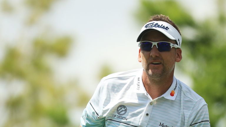 Ian Poulter of England watches his shot from the fourth tee during the third round of THE PLAYERS Championship