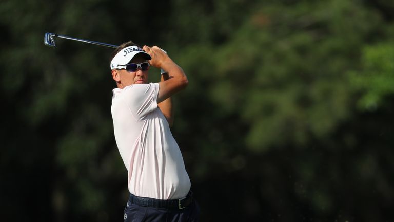 Ian Poulter of England plays a shot on the 14th hole during the final round of THE PLAYERS Championship