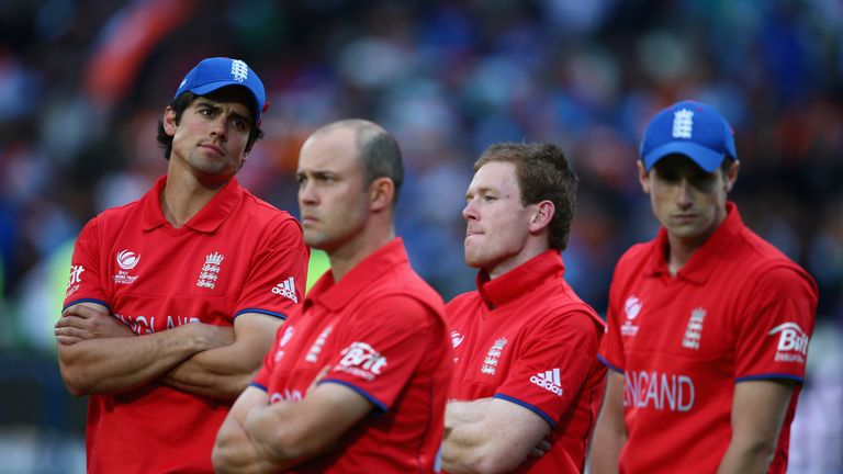 BIRMINGHAM, ENGLAND - JUNE 23:  Alastair Cook, Jonathan Trott, Eoin Morgan, and Chris Woakes look on after England lost to India during the ICC Champions T
