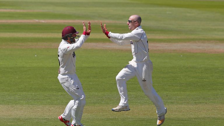 Jack Leach (R) and James Hildreth of Somerset celebrate the wicket of James Vince of Hampshire during  the Specsavers County Championship