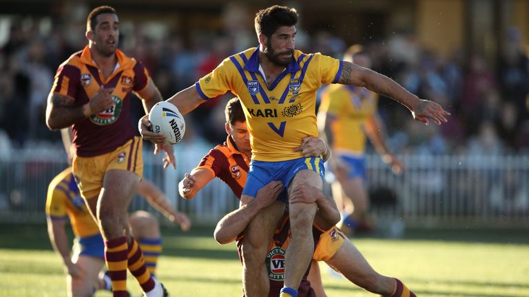 James Tamou looks to pass as he is tackled during the 2017 City versus Country Origin match