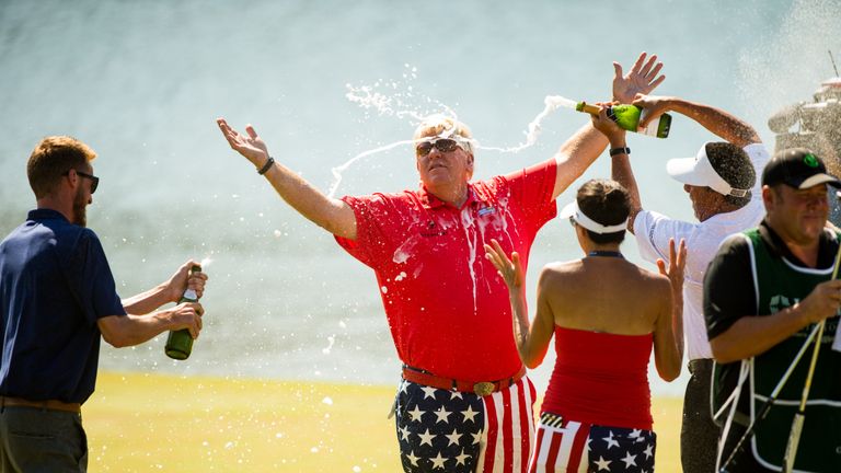 John Daly enjoys a champagne shower after winning the Insperity Invitational