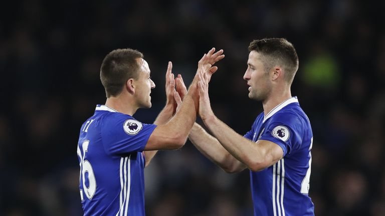 Chelsea's English defender John Terry (L) celebrates with Chelsea's English defender Gary Cahill after winning the English Premier League football match be