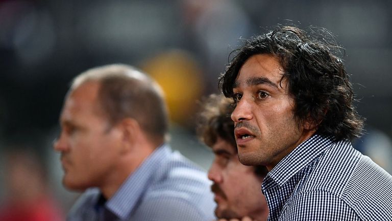 Johnathan Thurston of the Cowboys looks on from the bench