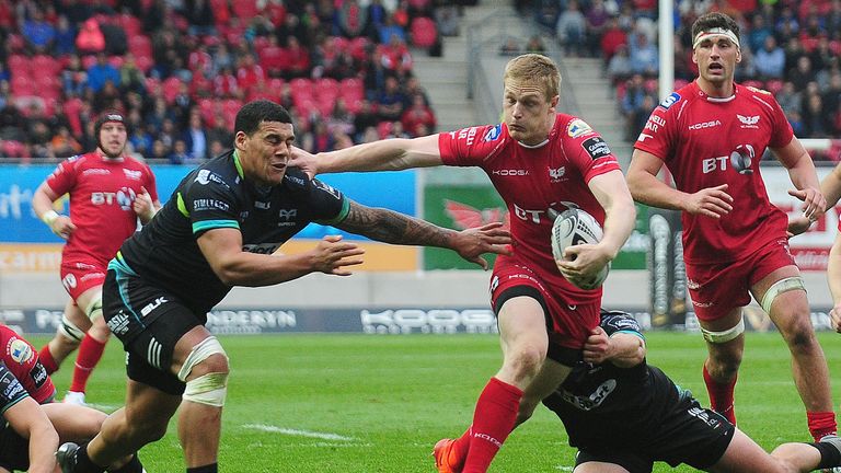 Scarlets vs Ospreys.Scarlets' Johnny McNicholl evades the tackle of Josh Matavesi of Ospreys.Mandatory Credit ..INPHO/Kevin Barnes