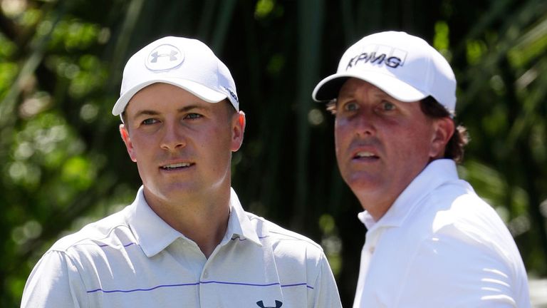 Jordan Spieth and Phil Mickelson look on at the fifth tee at Sawgrass