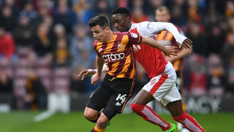 BRADFORD, ENGLAND - MAY 04:  Josh Cullen of Bradford City holds off Devante Cole of Fleetwood Town during the Sky Bet League One playoff semi final, first 