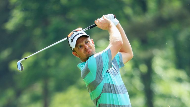 Justin Rose of England plays his second shot on the 9th hole during day three of the BMW PGA Championship at Wentworth