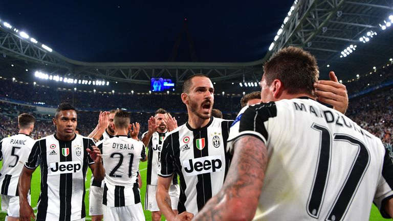TURIN, ITALY - MAY 09:  Mario Mandzukic of Juventus (obscured) celebrates scoring his sides first goal during the UEFA Champions League Semi Final second l