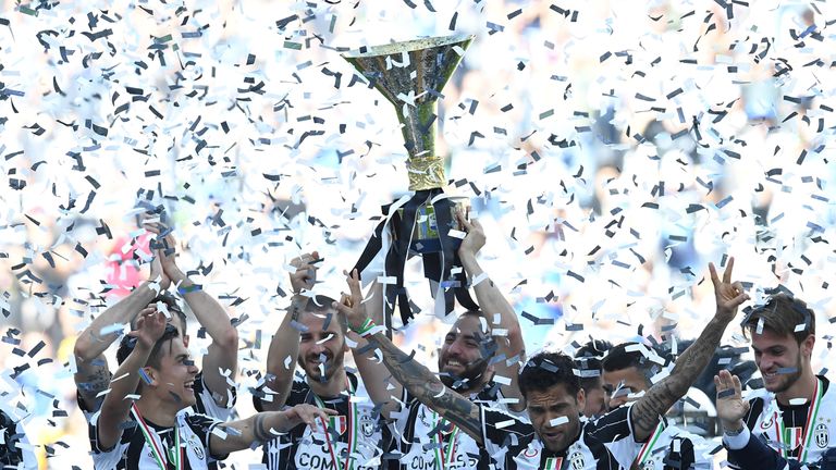 Gonzalo Higuain of Juventus FC celebrates with the trophy after beating FC Crotone 3-0 to win the Serie A Championships 