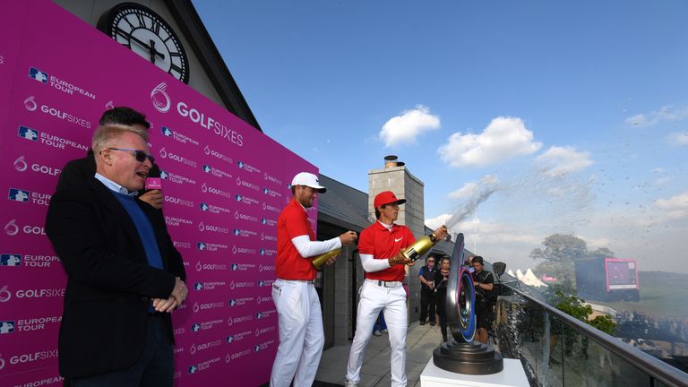 Keith Pelley looks on as Denmark celebrate their GolfSixes victory on the balcony at Centurion