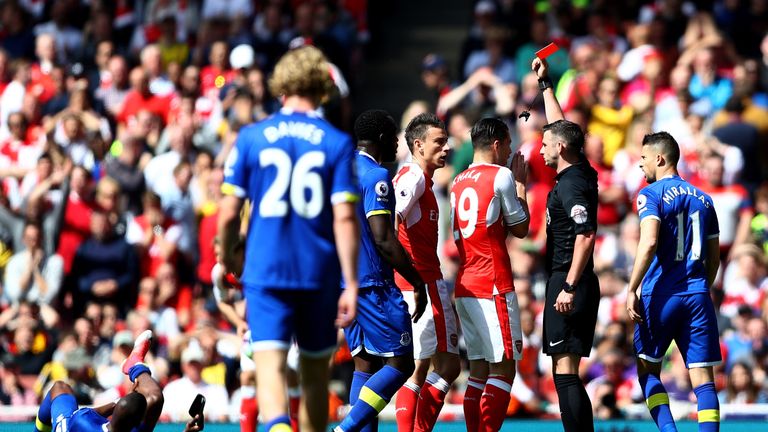 LONDON, ENGLAND - MAY 21: Laurent Koscielny of Arsenal is shown a red card by referee Michael Oliver during the Premier League match between Arsenal and Ev