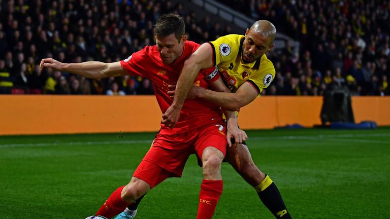 Liverpool's James Milner of Liverpool is tackled by Nordin Amrabat