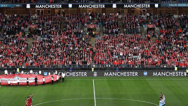 SYDNEY, AUSTRALIA - MAY 24:  Players observe a minutes silence for the victims of the recent Manchester bombing during the International Friendly match bet