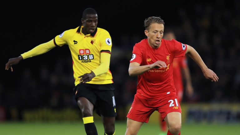 Liverpool midfielder Lucas Leiva of Liverpool is pursued by Watford's Abdoulaye Doucoure