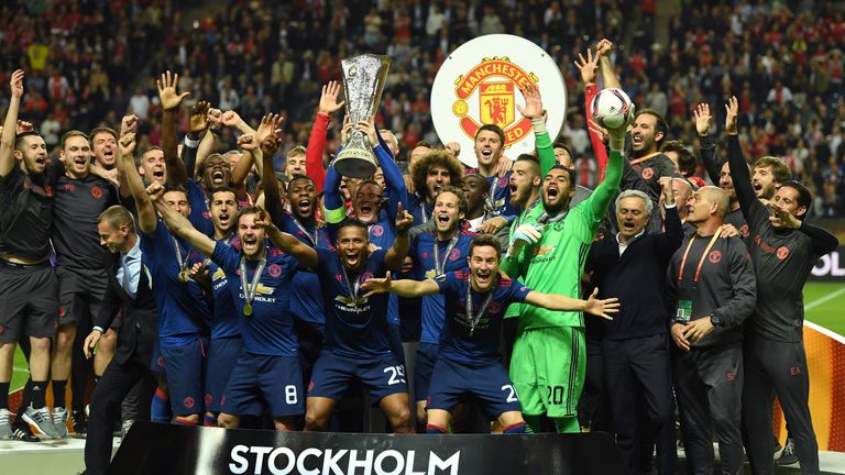 Wayne Rooney of Manchester United lifts the Europa League trophy