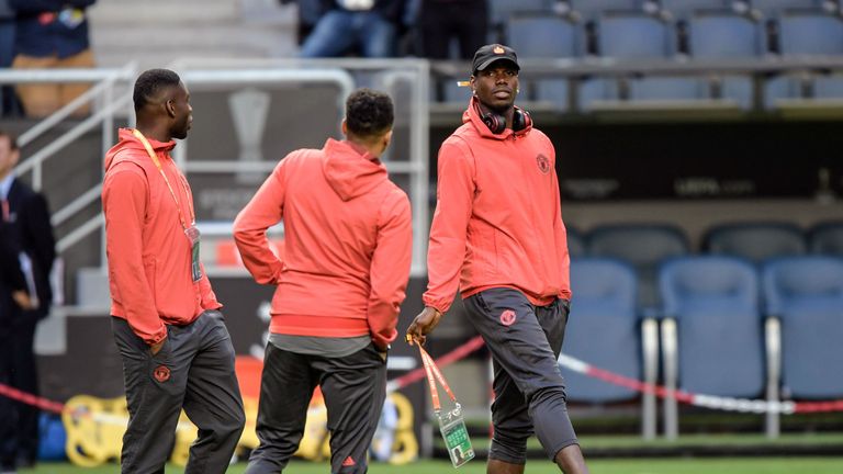 Manchester United's players including French midfielder Paul Pogba (R) inspect the pitch at the Friends Arena in Solna outside Stockholm on May 23, 2017, o