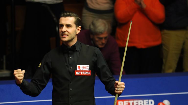 Mark Selby of England celebrates winning his semi-final match against Ding Junhui of China