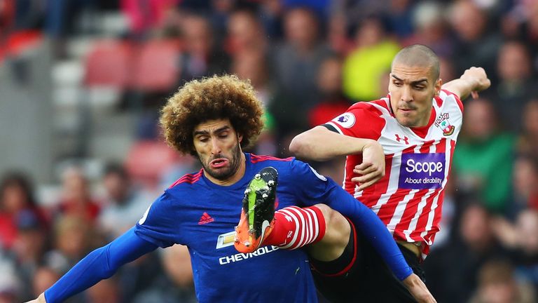 Marouane Fellaini of Manchester United and Oriol Romeu of Southampton battle for possession during the Premier League match 