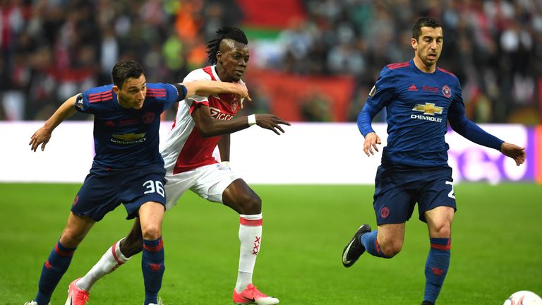 Manchester United's Italian defender Matteo Darmian (L) vies with Ajax Burkinabe forward Bertrand Traoré during the UEFA Europa League final football matc