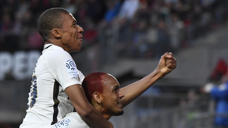 Monaco's Brazilian defender Fabinho (R) celebrates with Monaco's French forward Kylian Mbappe (L) after scoring a goal during  the French L1 football match