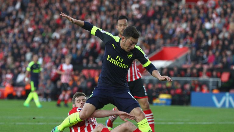 Mesut Ozil was denied from close range by a superb challenge from Jack Stephens