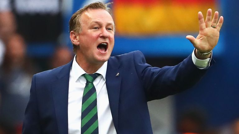 Michael O'Neill gestures toward his players during the EURO 2016 Group C match against Germany 